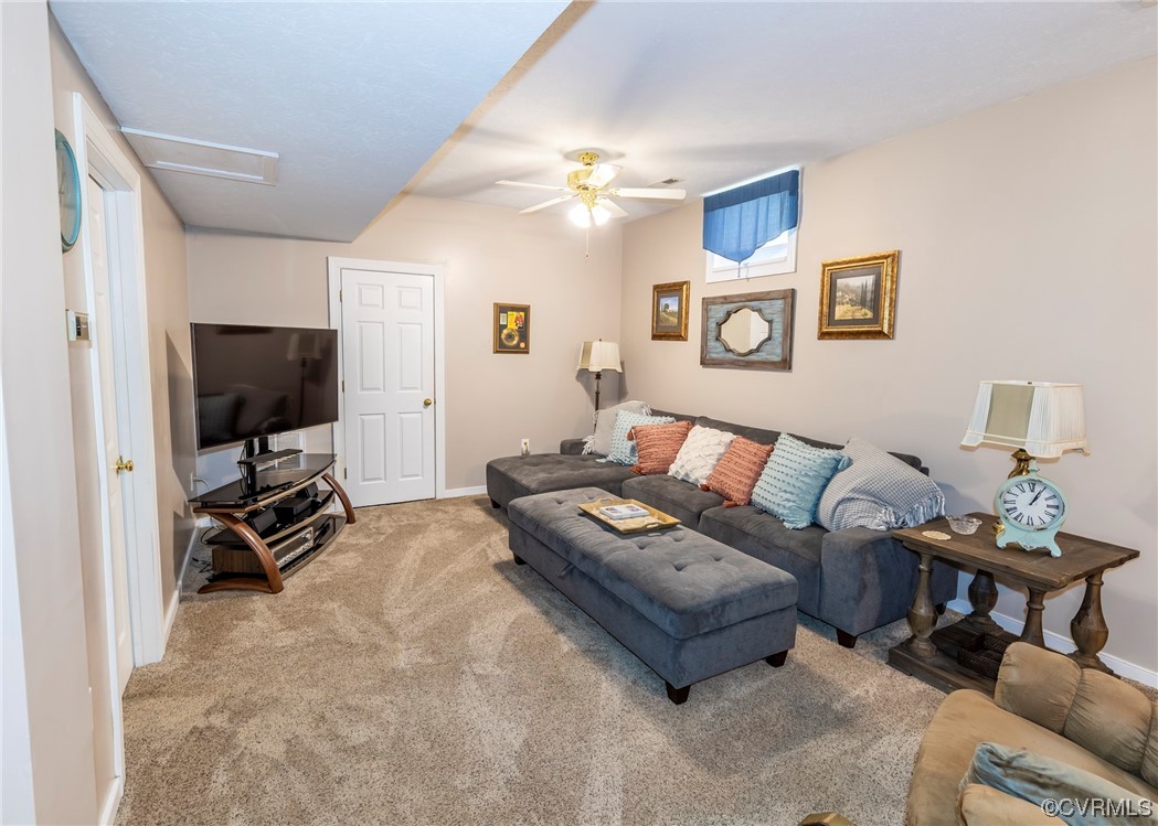 6373 Pine Slash Road Mechanicsville, VA 23116 - Photo 31 of 49 a living room with furniture and a flat screen tv