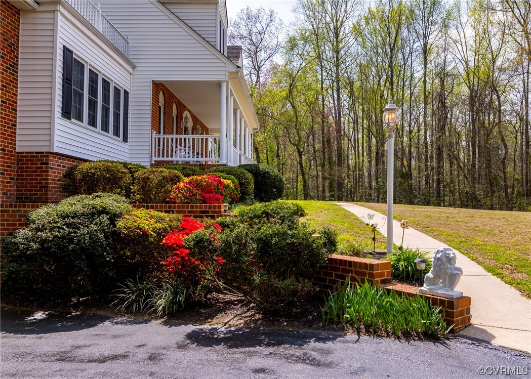 6373 Pine Slash Road Mechanicsville, VA 23116 - Photo 39 of 49 a view of a house with a yard and potted plants