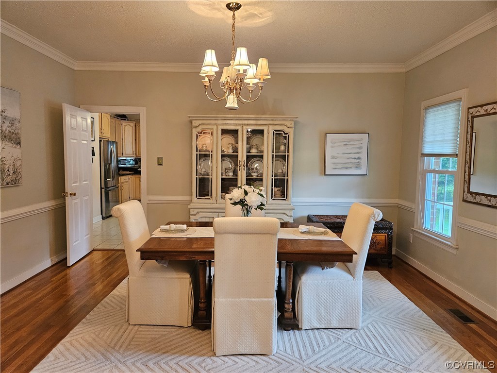 6373 Pine Slash Road Mechanicsville, VA 23116 - Photo 7 of 49 a view of a dining room with furniture and chandelier