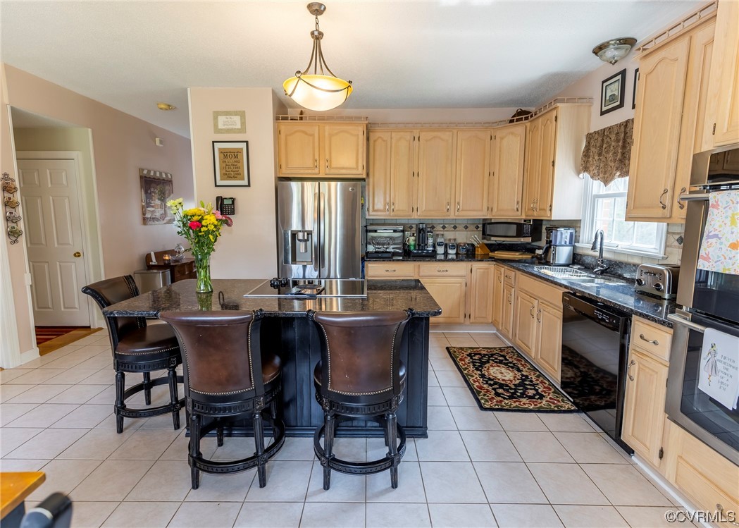 6373 Pine Slash Road Mechanicsville, VA 23116 - Photo 10 of 49 a kitchen with a dining table chairs stainless steel appliances and cabinets