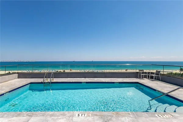 a view of a swimming pool and an outdoor space