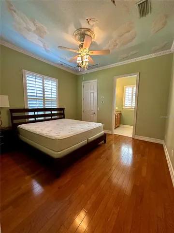 a bedroom with bed and window