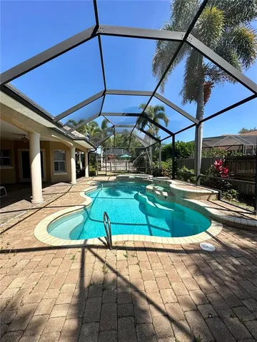 a view of a swimming pool with a patio
