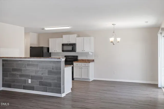 a kitchen with sink cabinets and window
