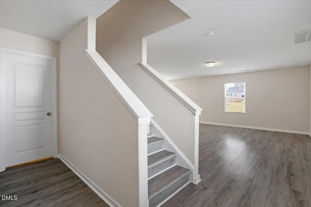 a view of entryway with wooden floor