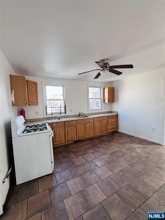 9 Sparrow Street Paterson, NJ 07524 - Photo 14 of 20 a kitchen with stainless steel appliances a stove a sink and a refrigerator
