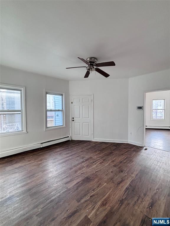 9 Sparrow Street Paterson, NJ 07524 - Photo 17 of 20 an empty room with wooden floor closet and windows