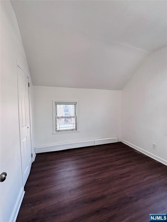 9 Sparrow Street Paterson, NJ 07524 - Photo 19 of 20 a view of an empty room with wooden floor and a window