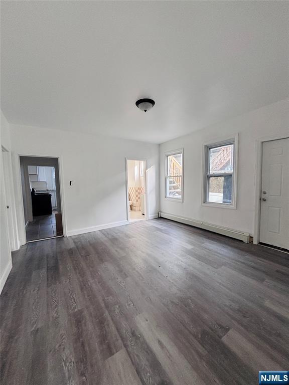 9 Sparrow Street Paterson, NJ 07524 - Photo 4 of 20 a view of empty room with window and wooden floor