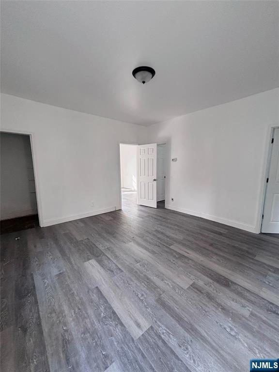 9 Sparrow Street Paterson, NJ 07524 - Photo 5 of 20 a view of an empty room with wooden floor and a window