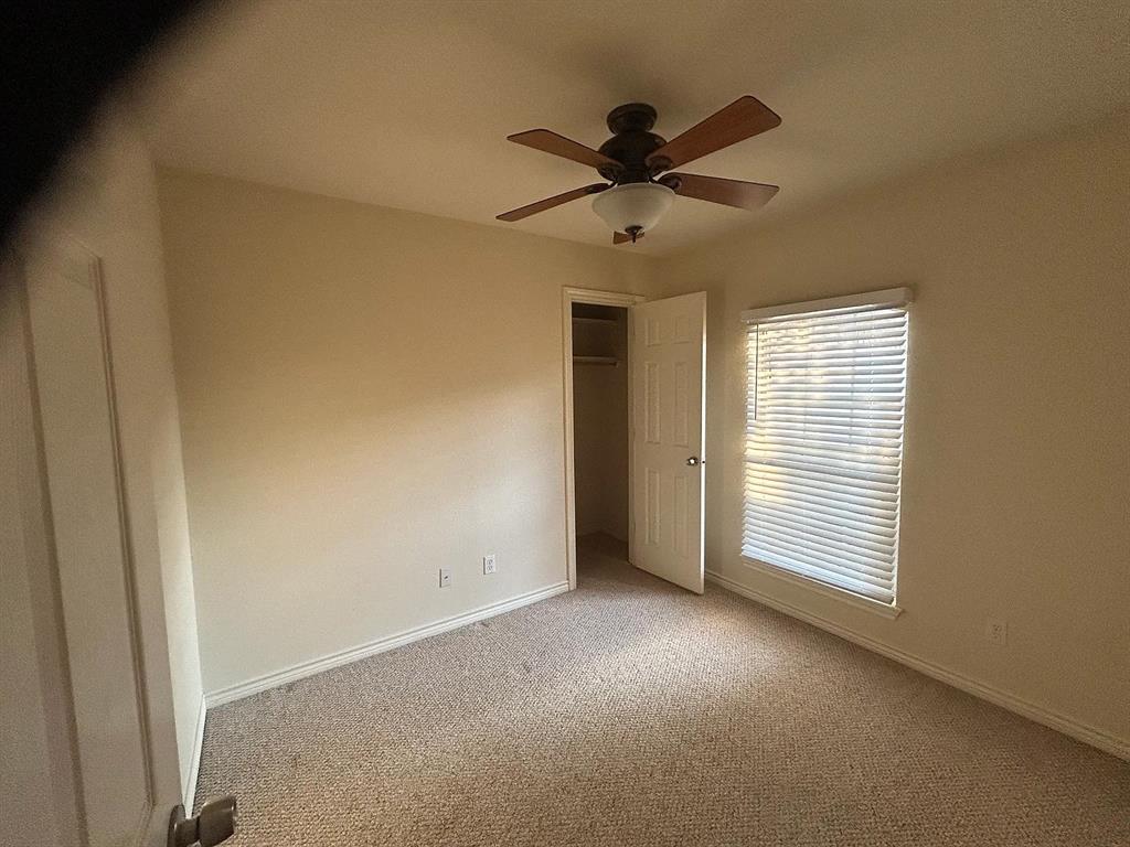 616 North Ave C Springtown, TX 76082 - Photo 10 of 13 a view of a livingroom with a ceiling fan and window