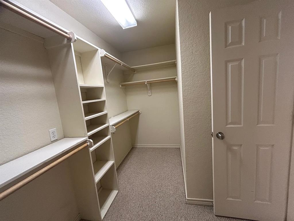 616 North Ave C Springtown, TX 76082 - Photo 7 of 13 a view of walk in closet with empty racks
