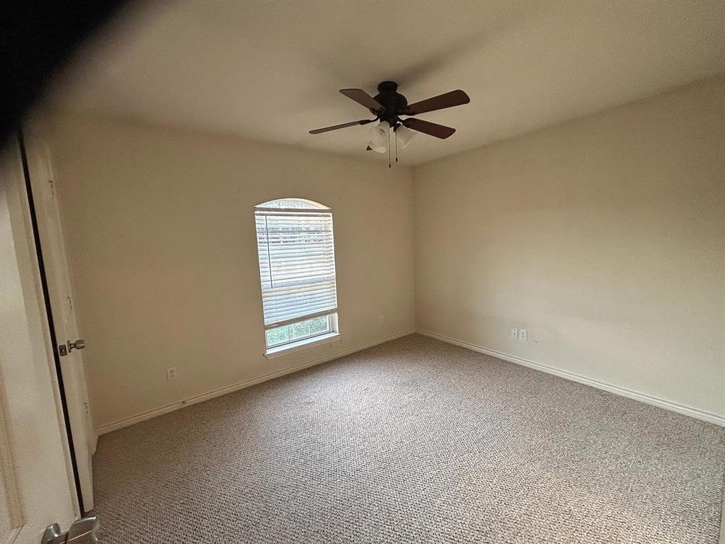 616 North Ave C Springtown, TX 76082 - Photo 9 of 13 a view of an empty room with a window