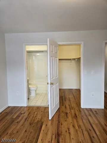 a bathroom with a shower and a toilet