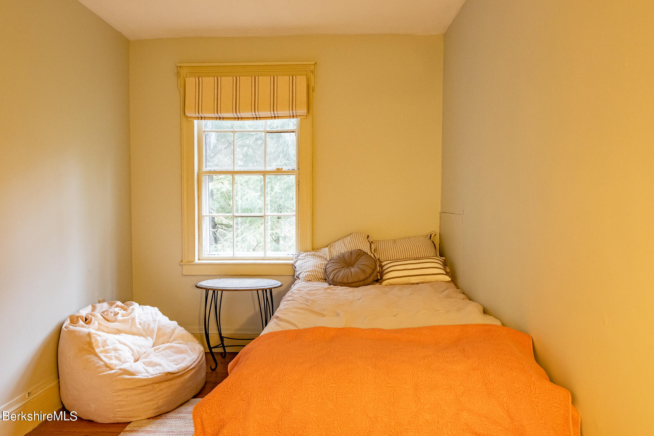 132 Sandisfield Road Sandisfield, MA 01255 - Photo 12 of 32 a bedroom with a bed and a window