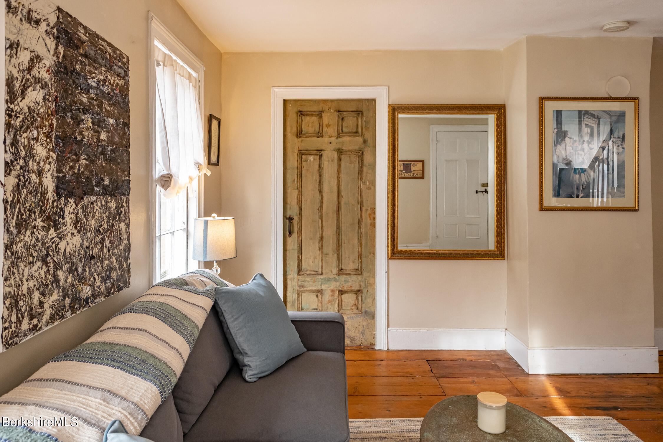 132 Sandisfield Road Sandisfield, MA 01255 - Photo 8 of 32 a bedroom with a bed and a couch