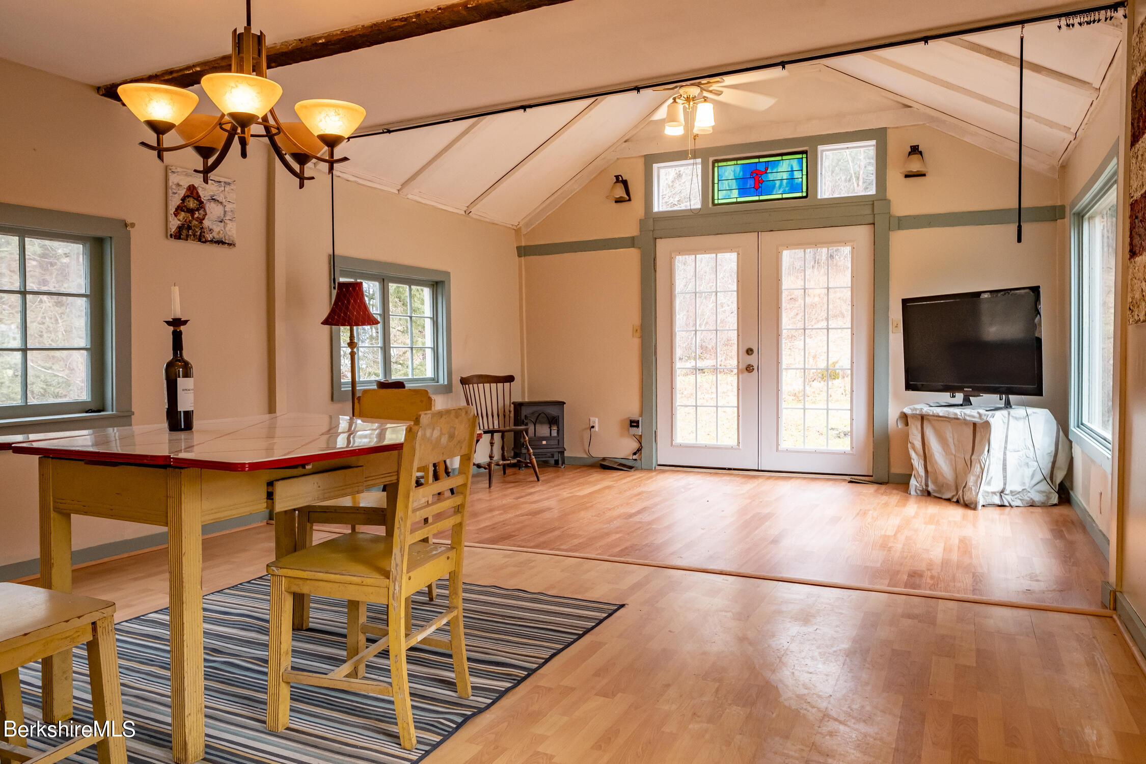 132 Sandisfield Road Sandisfield, MA 01255 - Photo 9 of 32 a view of a livingroom with furniture and a flat screen tv