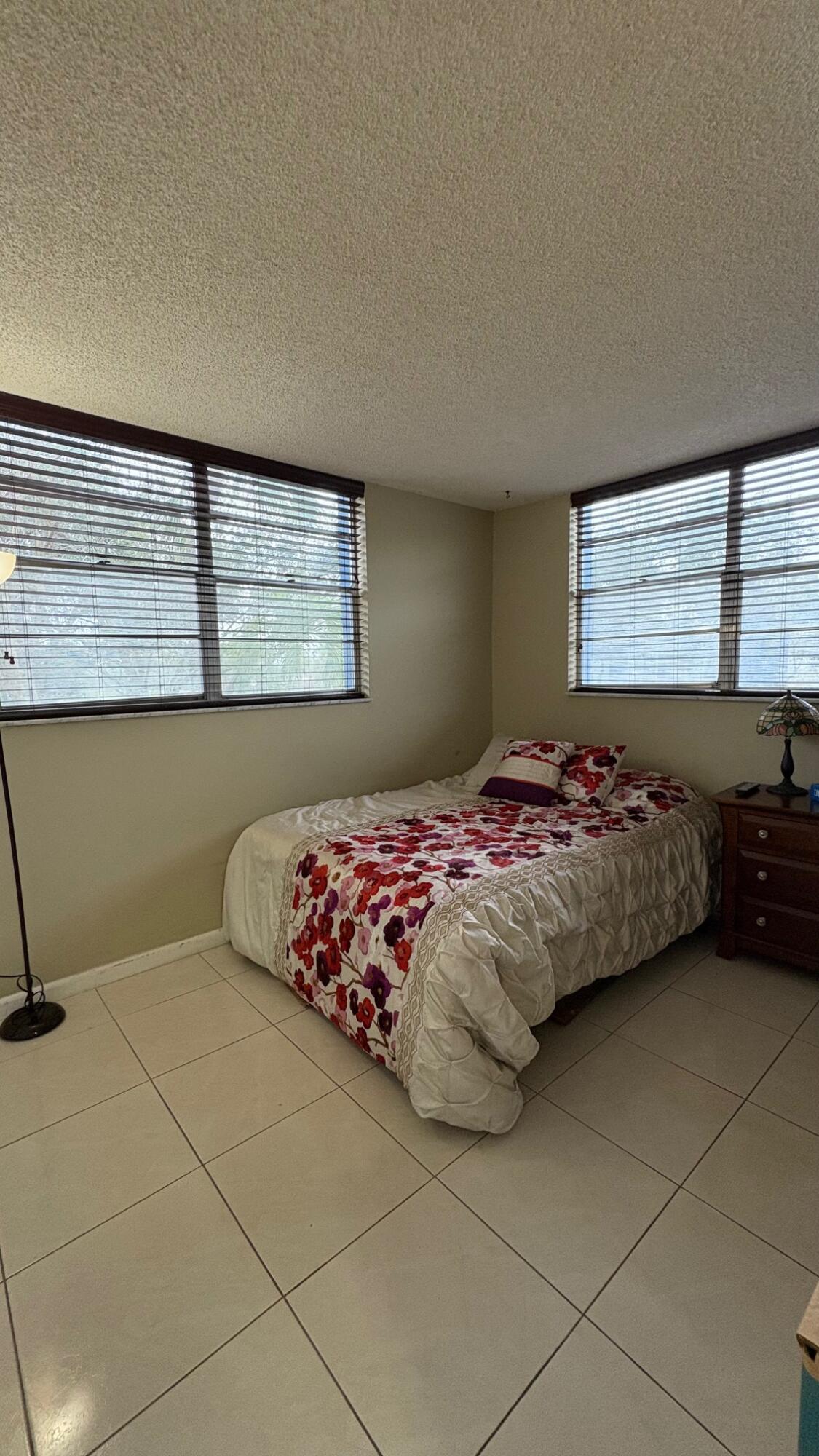 3070 Holiday Springs Boulevard, Unit 201 Margate, FL 33063 - Photo 20 of 30 a bedroom with a bed and window