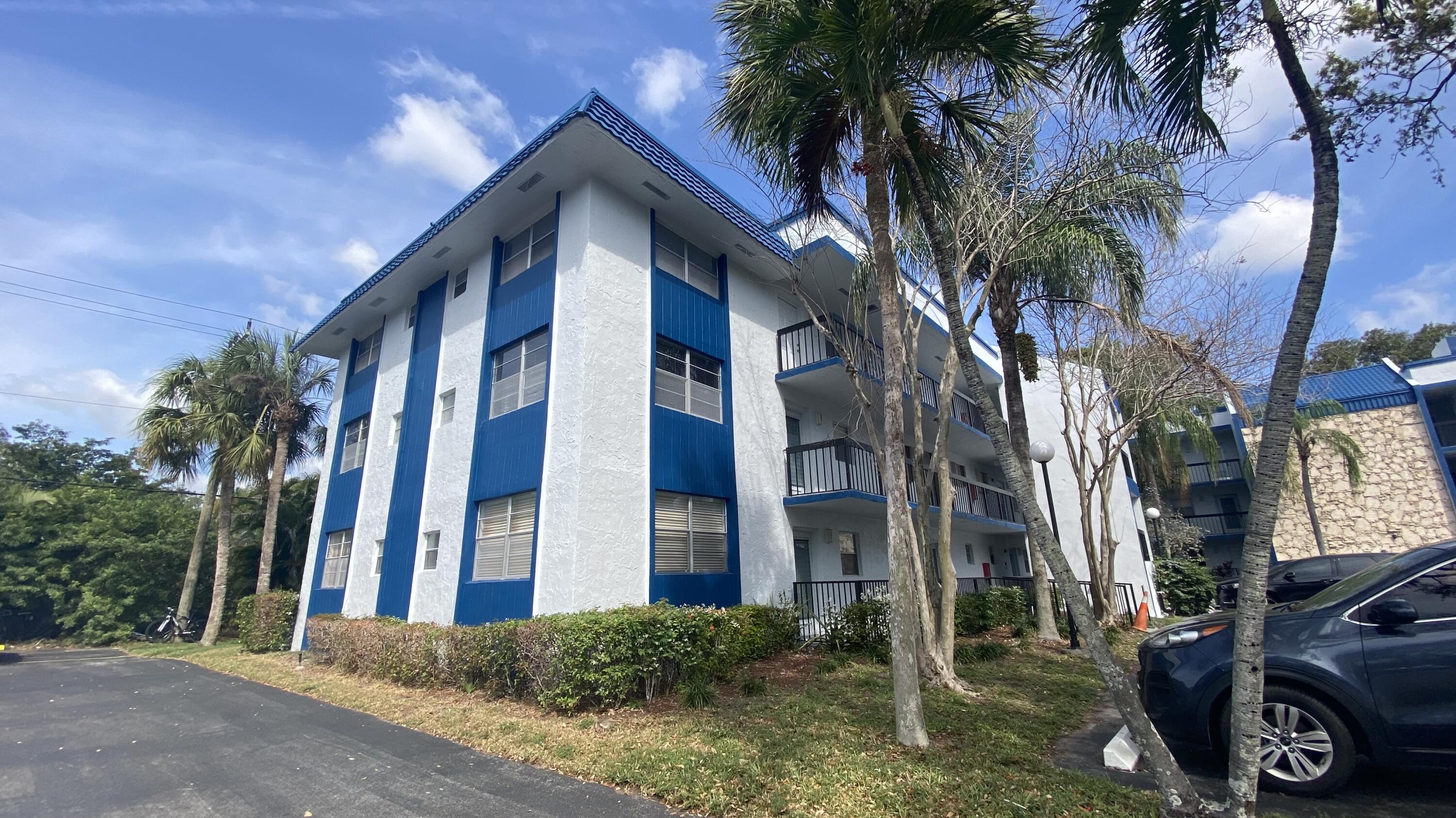 3070 Holiday Springs Boulevard, Unit 201 Margate, FL 33063 - Photo 3 of 30 a view of a house with a yard