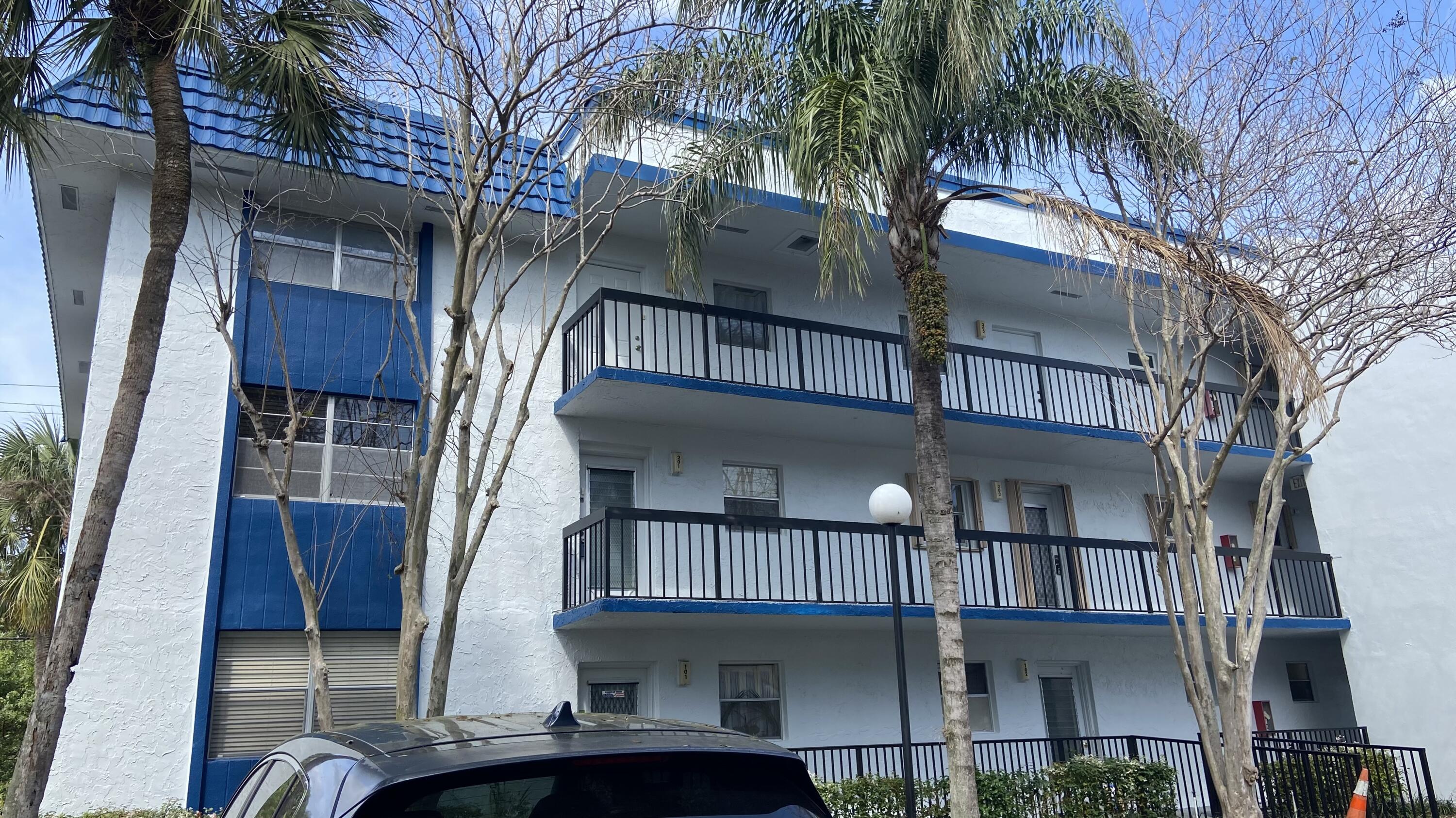 3070 Holiday Springs Boulevard, Unit 201 Margate, FL 33063 - Photo 4 of 30 a front view of a house with balcony