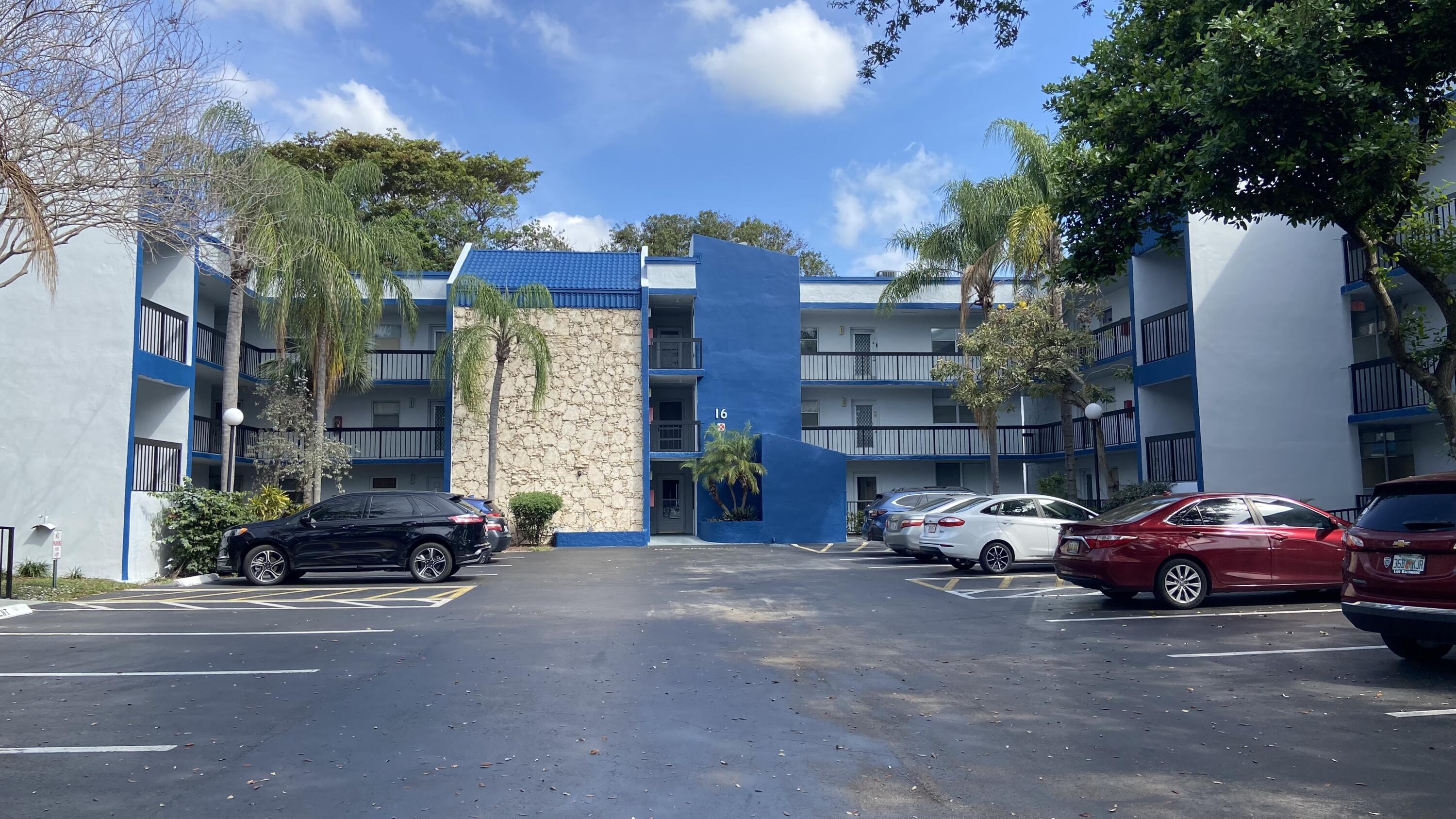 3070 Holiday Springs Boulevard, Unit 201 Margate, FL 33063 - Photo 5 of 30 a car parked in front of a building