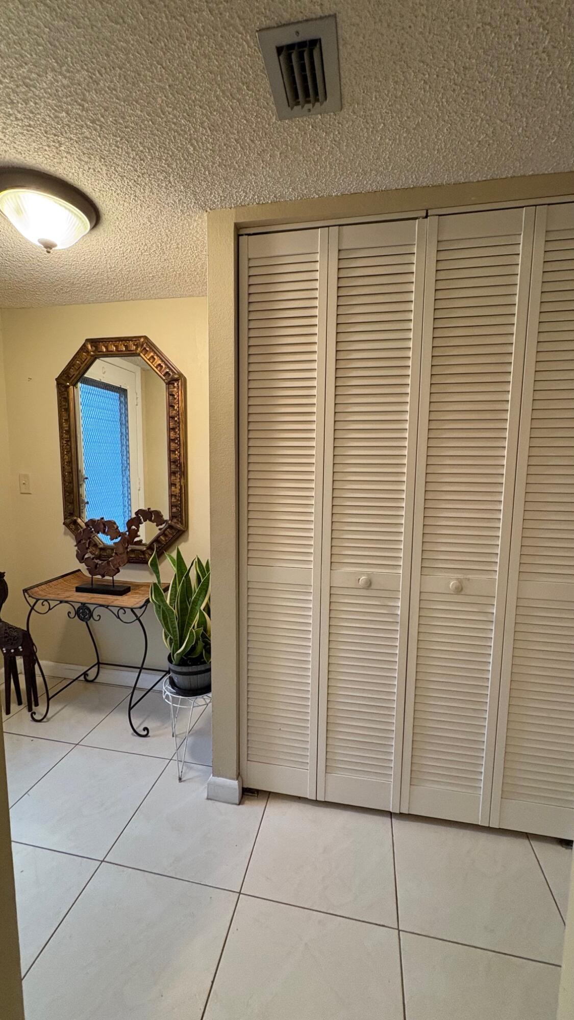 3070 Holiday Springs Boulevard, Unit 201 Margate, FL 33063 - Photo 7 of 30 a bathroom with a sink and a mirror
