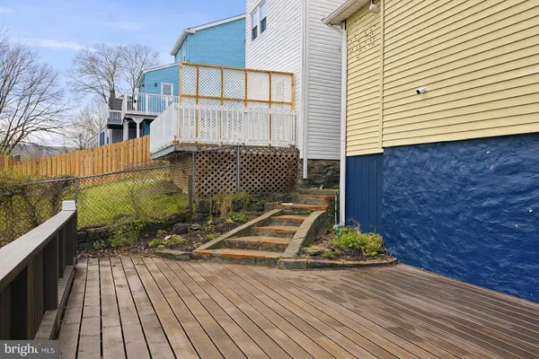 a backyard of a house with wooden floor