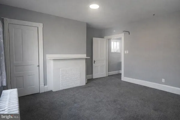 an empty room with closet area