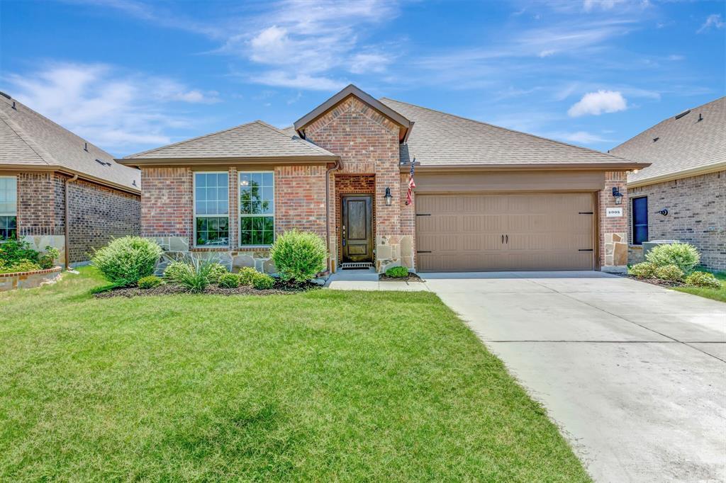 4005 Ellinger Drive Forney, TX 75126 - Photo 1 of 1 a front view of a house with garden
