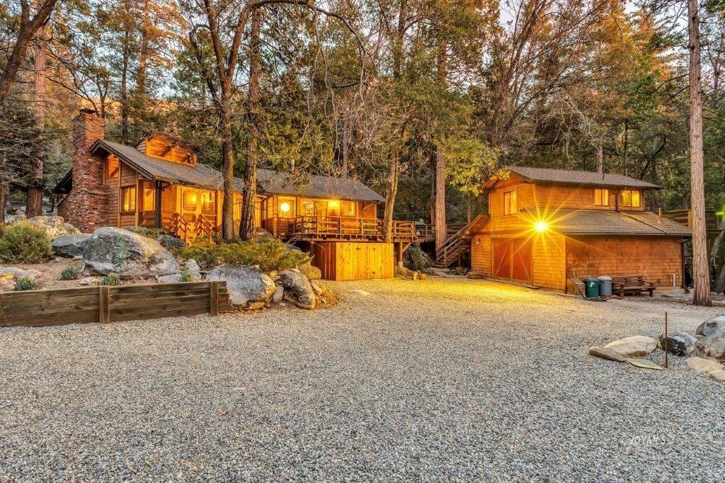 24631 Upper Rim Rock Road Idyllwild, CA 92549 - Photo 1 of 34 a view of a house with backyard and sitting area