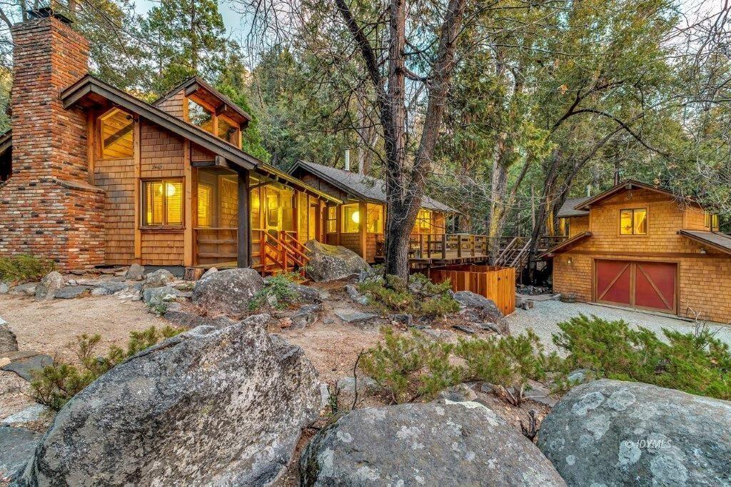 24631 Upper Rim Rock Road Idyllwild, CA 92549 - Photo 2 of 34 a front view of a house with garden