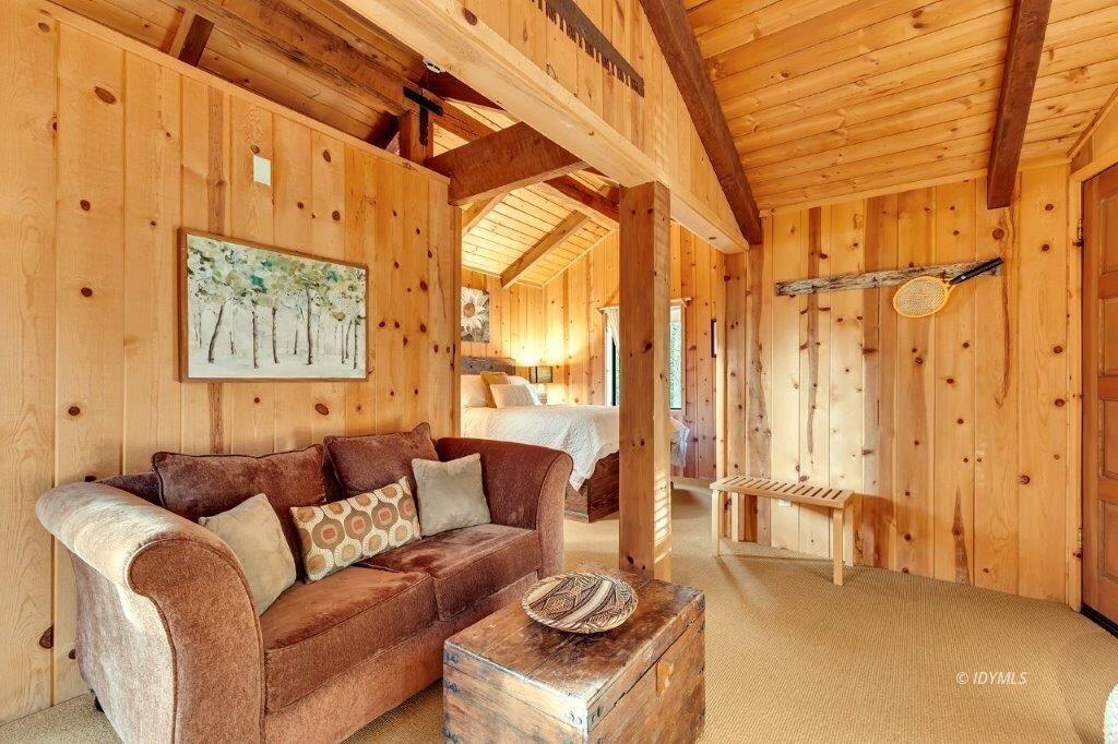 24631 Upper Rim Rock Road Idyllwild, CA 92549 - Photo 24 of 34 a living room with furniture and a large window