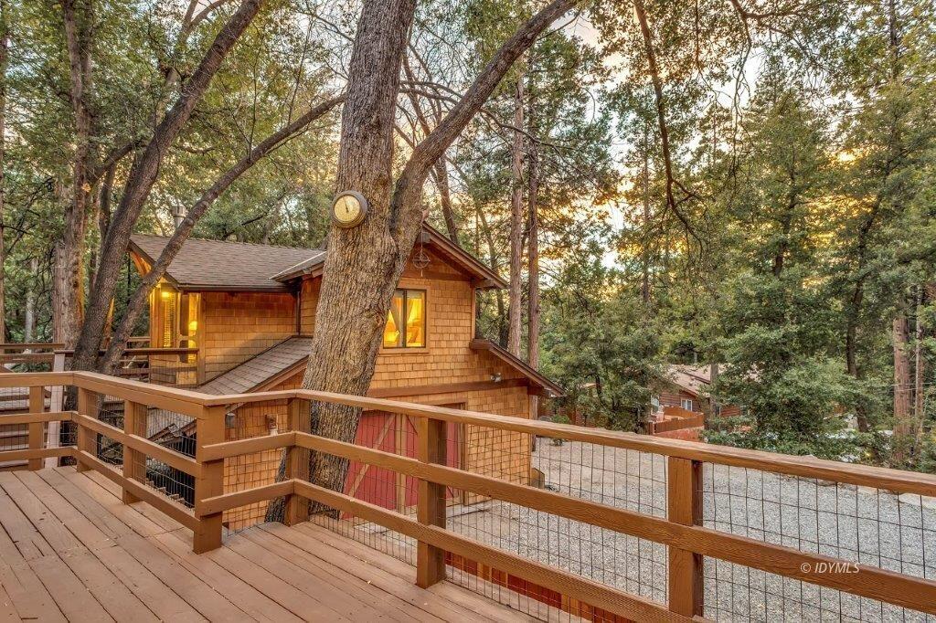24631 Upper Rim Rock Road Idyllwild, CA 92549 - Photo 30 of 34 a view of a house with a balcony