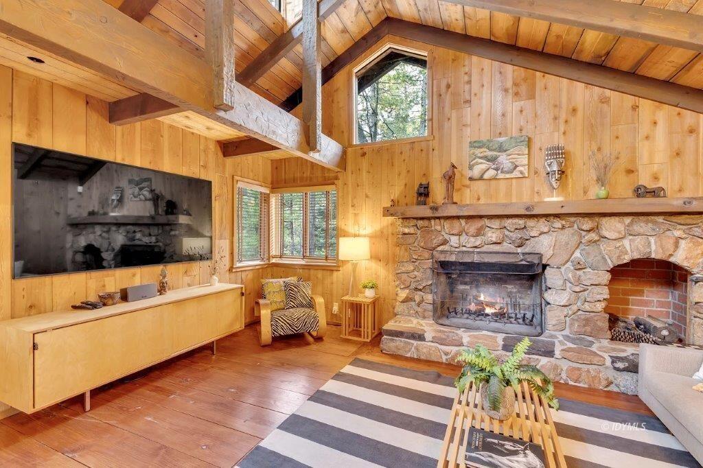 24631 Upper Rim Rock Road Idyllwild, CA 92549 - Photo 4 of 34 a living room with furniture a fireplace and a window
