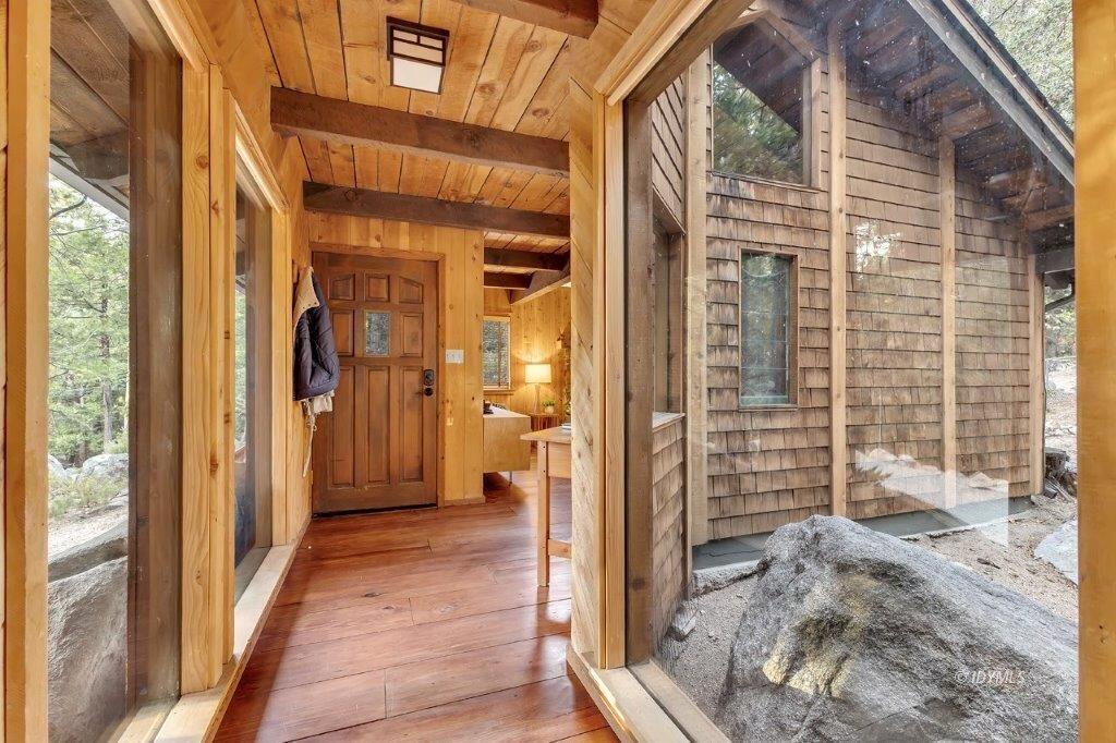 24631 Upper Rim Rock Road Idyllwild, CA 92549 - Photo 8 of 34 a view of a door and chair in the balcony