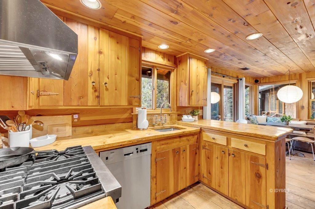 24631 Upper Rim Rock Road Idyllwild, CA 92549 - Photo 10 of 34 a kitchen with a sink and a stove top oven