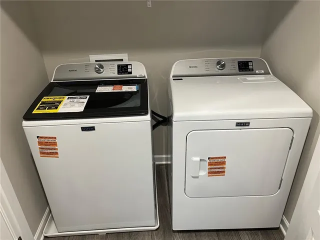 a utility room with dryer and washer