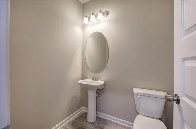 a bathroom with a toilet and a sink