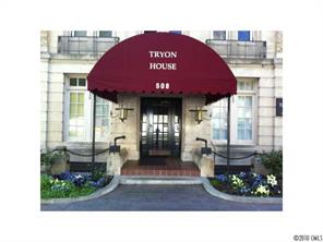 a picture of a bench in front of building