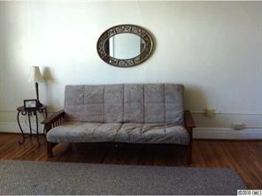 508 North Tryon Street, Unit 322 Charlotte, NC 28202 - Photo 5 of 7 a bedroom with a bed window and a table