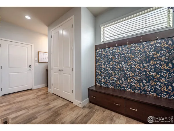 a view of entryway with wooden floor