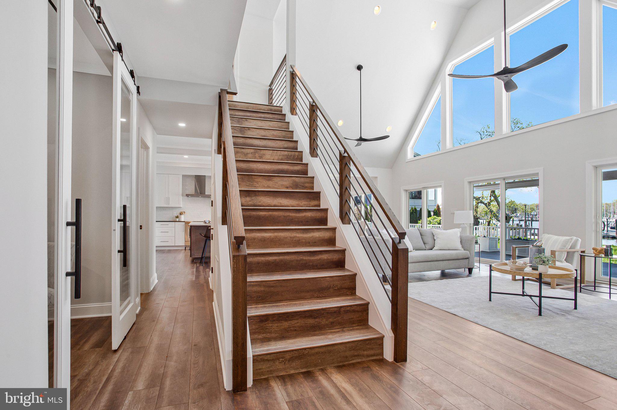 6146 Drum Point Road Deale, MD 20751 - Photo 16 of 75 a view of entryway and hall with wooden floor