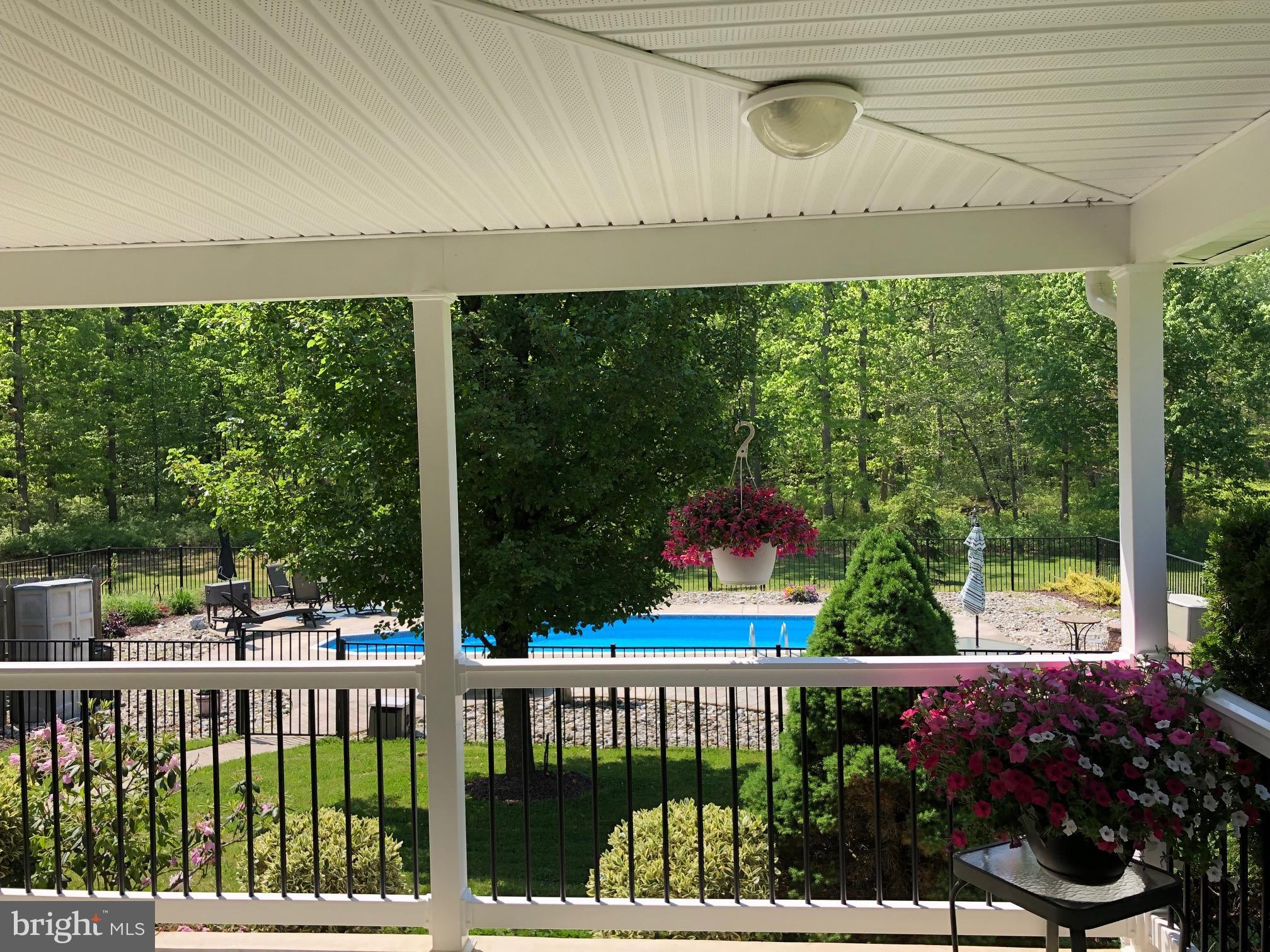 28 Blue Anchor Road Sicklerville, NJ 08081 - Photo 32 of 60 Wrap around porch with a view of the pool!