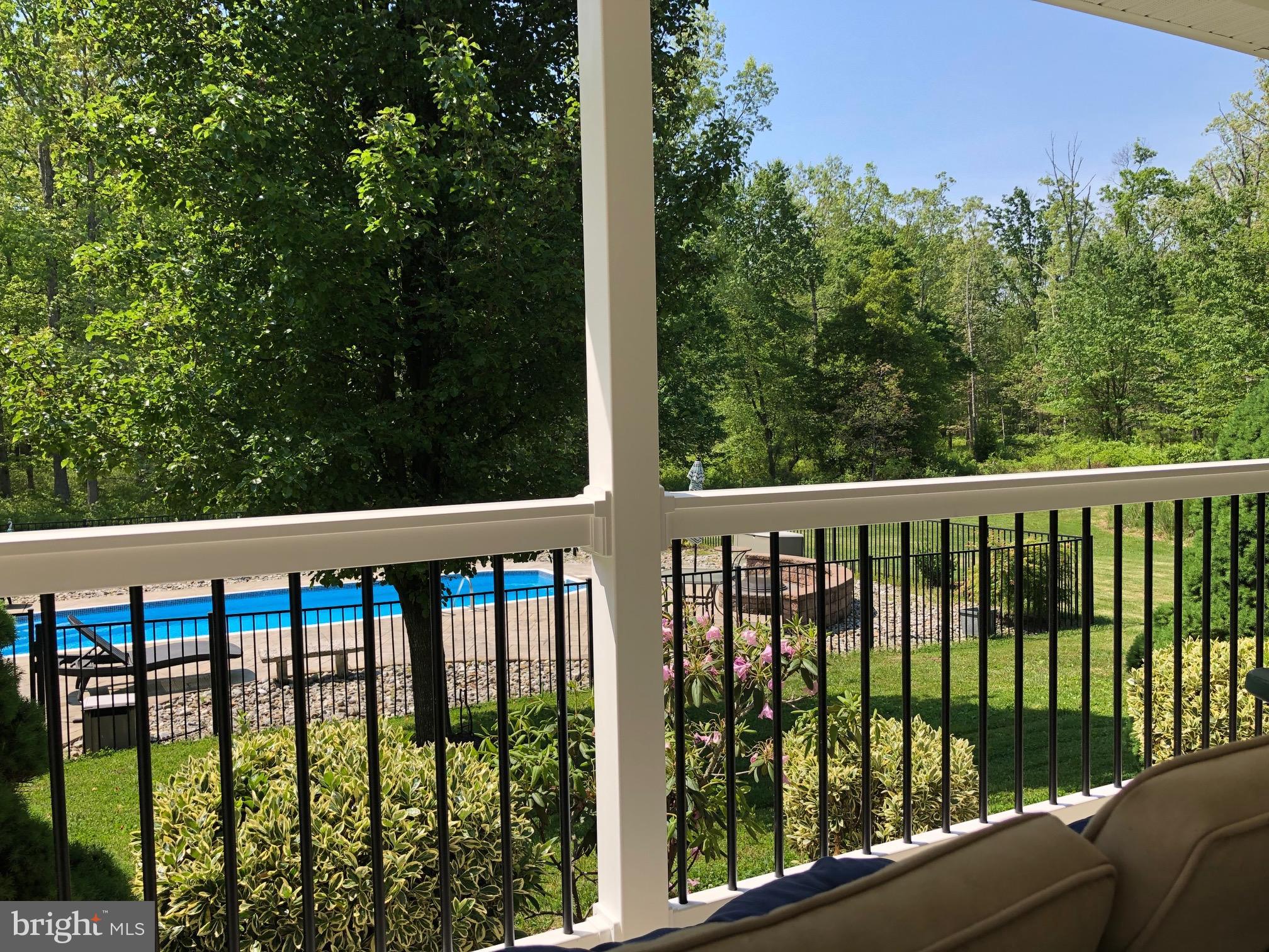 28 Blue Anchor Road Sicklerville, NJ 08081 - Photo 33 of 60 Wrap around porch with a view of the pool!