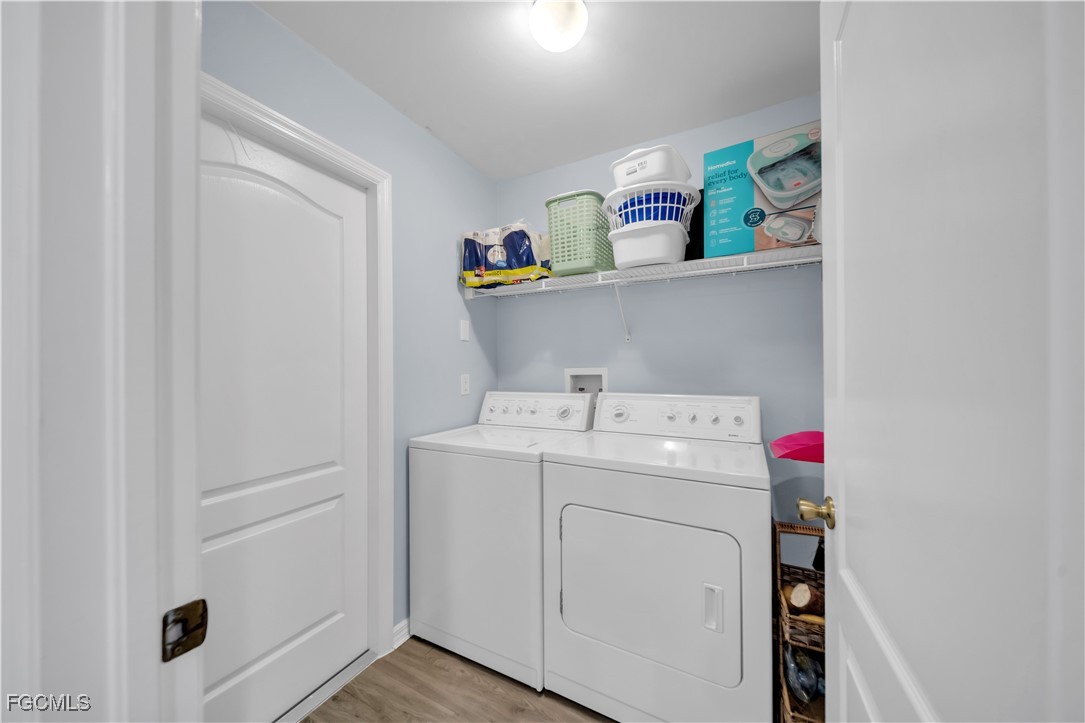 710 Homestead Road South Lehigh Acres, FL 33974 - Photo 12 of 38 a utility room with dryer and washer