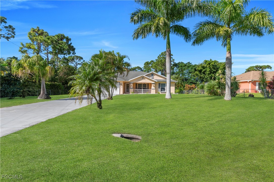 710 Homestead Road South Lehigh Acres, FL 33974 - Photo 3 of 38 a view of a house with a yard