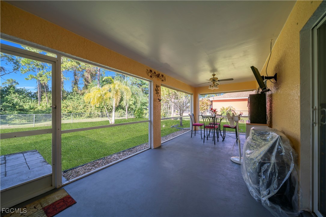 710 Homestead Road South Lehigh Acres, FL 33974 - Photo 32 of 38 a view of a porch with chairs and backyard