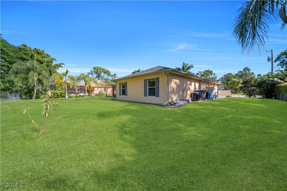 710 Homestead Road South Lehigh Acres, FL 33974 - Photo 36 of 38 a view of a house with a big yard
