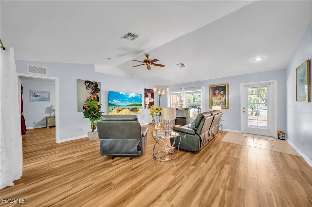 710 Homestead Road South Lehigh Acres, FL 33974 - Photo 7 of 38 a living room with furniture and a wooden floor