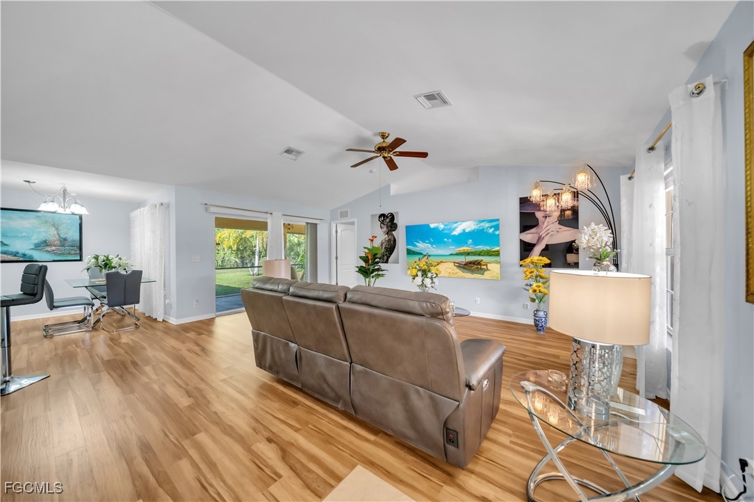 710 Homestead Road South Lehigh Acres, FL 33974 - Photo 10 of 38 a living room with furniture and a wooden floor